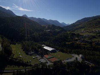 High angle view of houses and mountains against sky