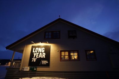 Low angle view of illuminated building against sky