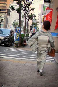 Woman standing on city street