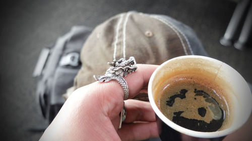 Close-up of hand holding coffee