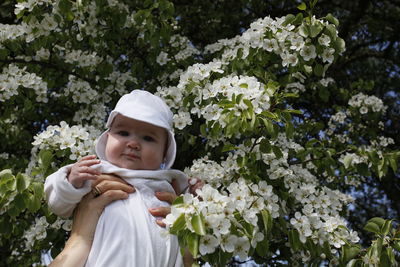 Portrait of girl with white flowers