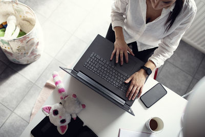 High angle view of woman using laptop