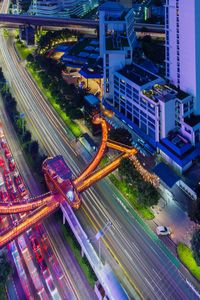 High angle view of light trails on road at night