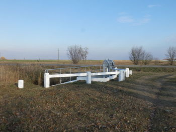 Built structure on field against clear sky