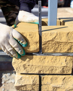 Close-up of hand working on wood