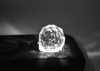 Close-up of crystal ball on table