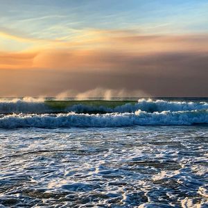 Scenic view of sea against sky during sunset
