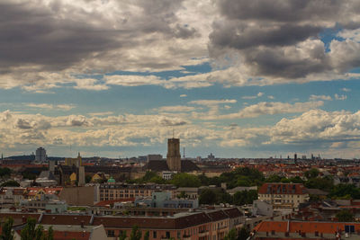 High angle view of buildings in town against sky