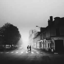 Blurred motion of people walking on road