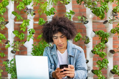 Young woman using mobile phone