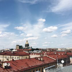 View of town against cloudy sky