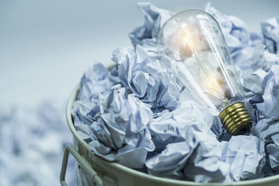 Close-up of light bulb against sky