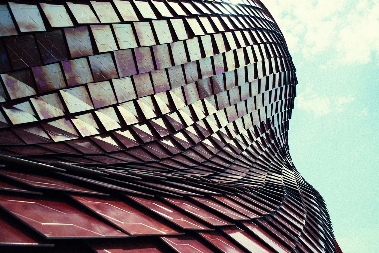 low angle view, pattern, built structure, architecture, building exterior, sky, design, modern, no people, day, outdoors, shape, architectural feature, repetition, close-up, striped, part of, spiral, geometric shape, building