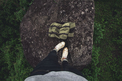 Low section of person standing on rock