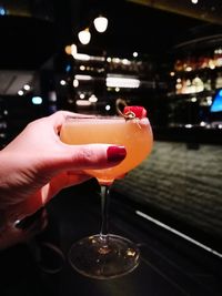 Close-up of woman holding wineglass