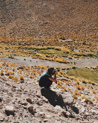 Man photographing on landscape