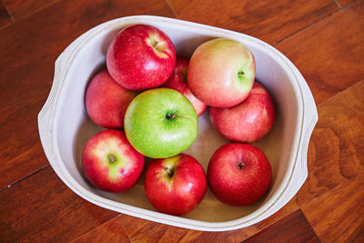 High angle view of apples in bowl on table