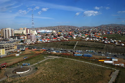 High angle view of buildings in city against sky