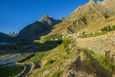 Scenic view of mountains against clear blue sky