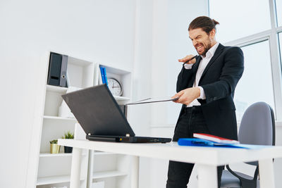 Businessman talking on video call at office