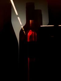 Close-up of beer glass bottle against black background