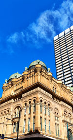 Low angle view of building against blue sky