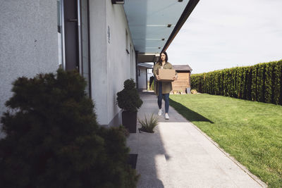 Rear view of man walking on road