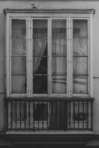 Broken glass window of old building