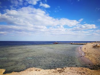 Scenic view of sea against blue sky