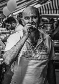 Portrait of chef eating in restaurant