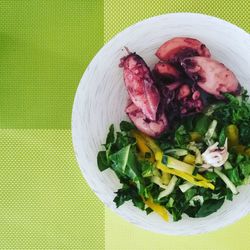 Directly above shot of seafood and salad served in plate on table