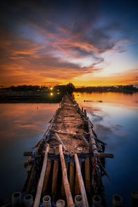 Scenic view of lake against sky during sunset