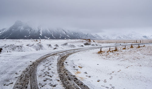 Scenic view of snowcapped mountains against sky