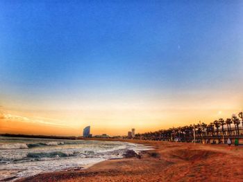 Scenic view of beach against sky during sunset