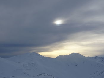 Scenic view of snowcapped mountains against sky