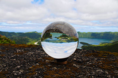 Close-up of crystal ball on glass