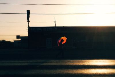 View of built structures at sunset