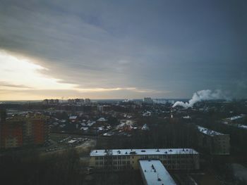 High angle view of illuminated buildings in city against sky