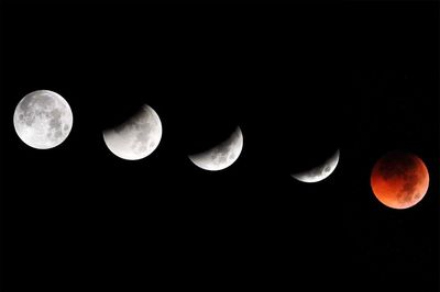 Scenic view of moon against clear sky at night