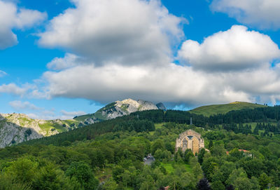 Panoramic view of trees and buildings against sky