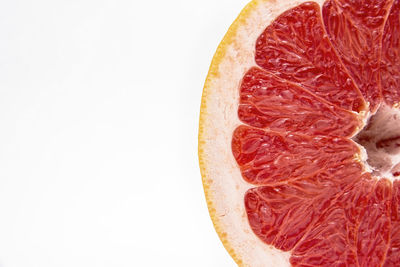 Close-up of lemon slice against white background