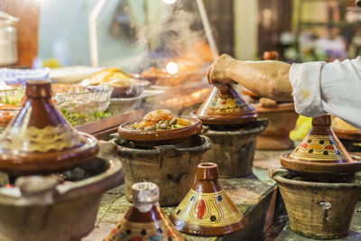 Midsection of people at market stall