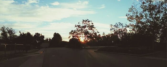 Empty road at sunset