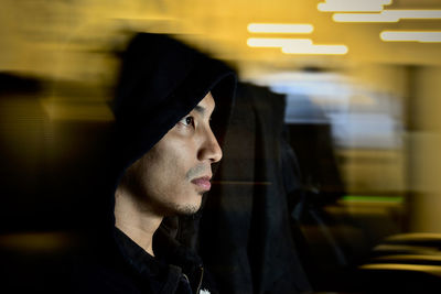 Portrait of young man looking away