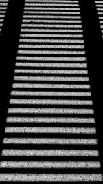 High angle view of sunlight falling on tiled floor