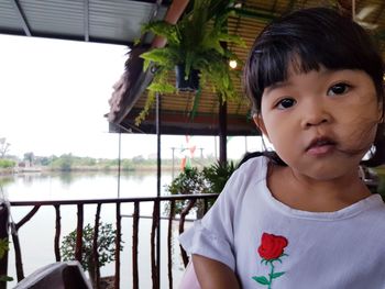 Portrait of cute girl in balcony