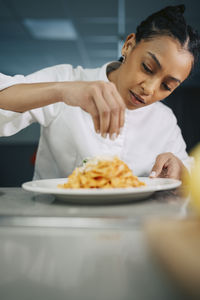 Young woman having food