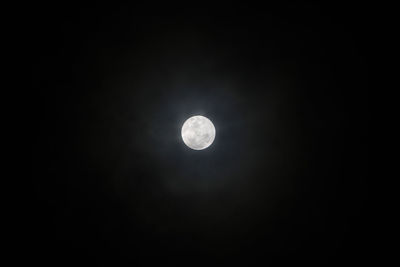 Low angle view of moon against sky at night