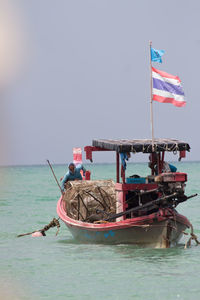 Nautical vessel on sea against clear sky