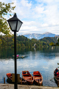 Gazebo by lake against sky